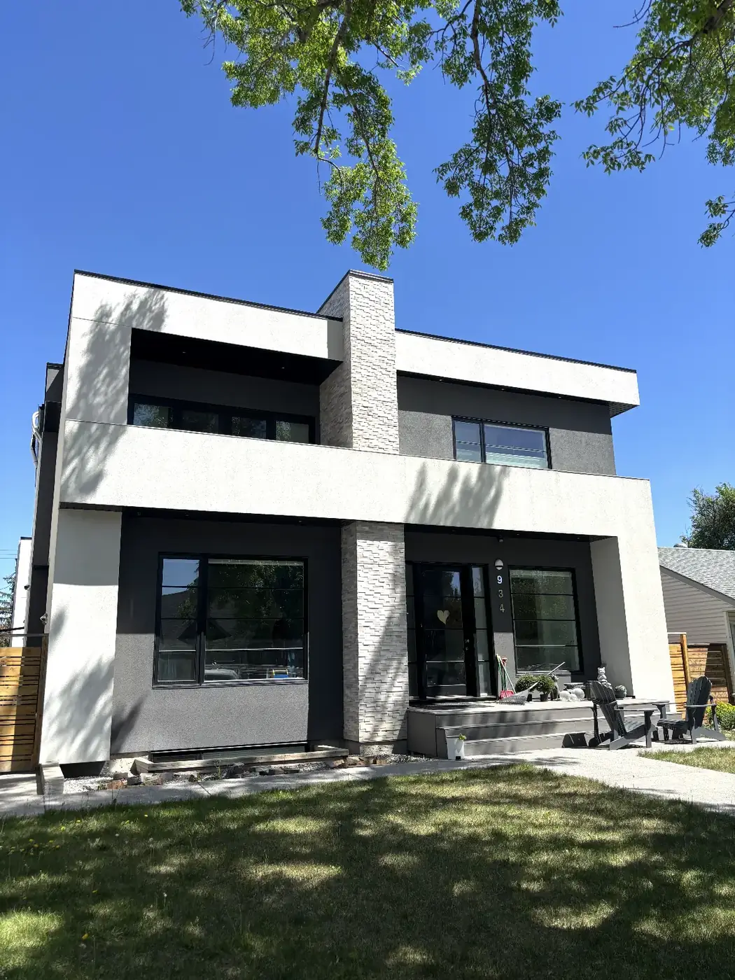 The same Calgary infill front elevation finished in white and charcoal acrylic stucco