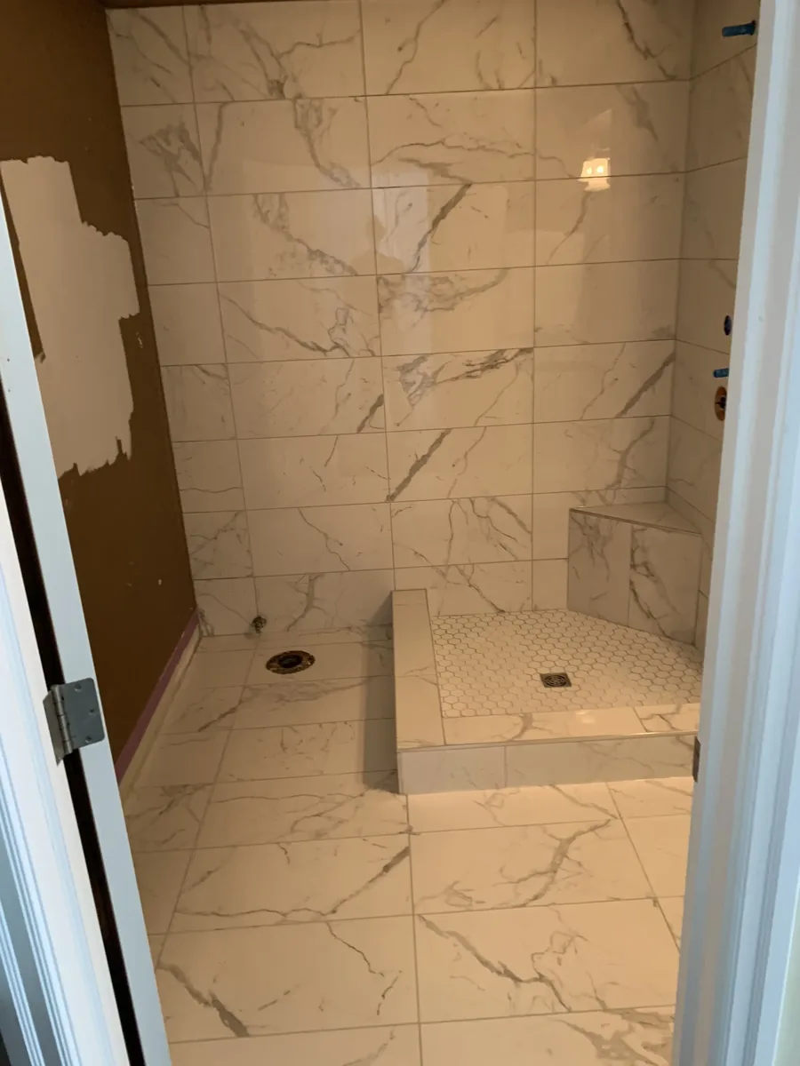 Calgary bathroom after tile renovation — Schluter-Kerdi shower, modern tile finish