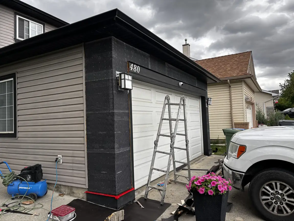 Calgary garage front stripped and wrapped in lath and mesh, ready for new stone veneer