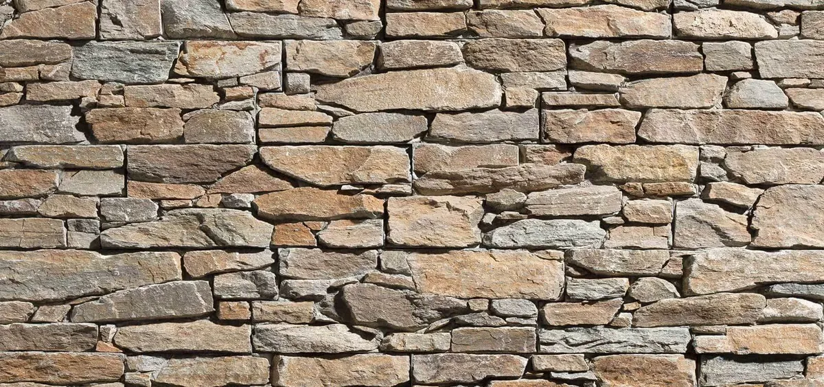 Natural stone masonry installation Calgary — full-bed natural stone facade