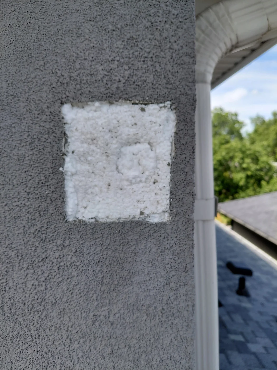 New foam insulation fitted flush into the repaired opening on a Calgary EIFS wall