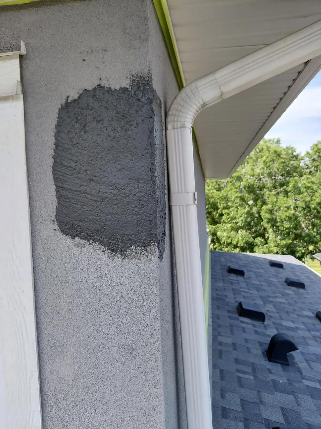 Hardened protective coating applied over the completed woodpecker repair on a Calgary home